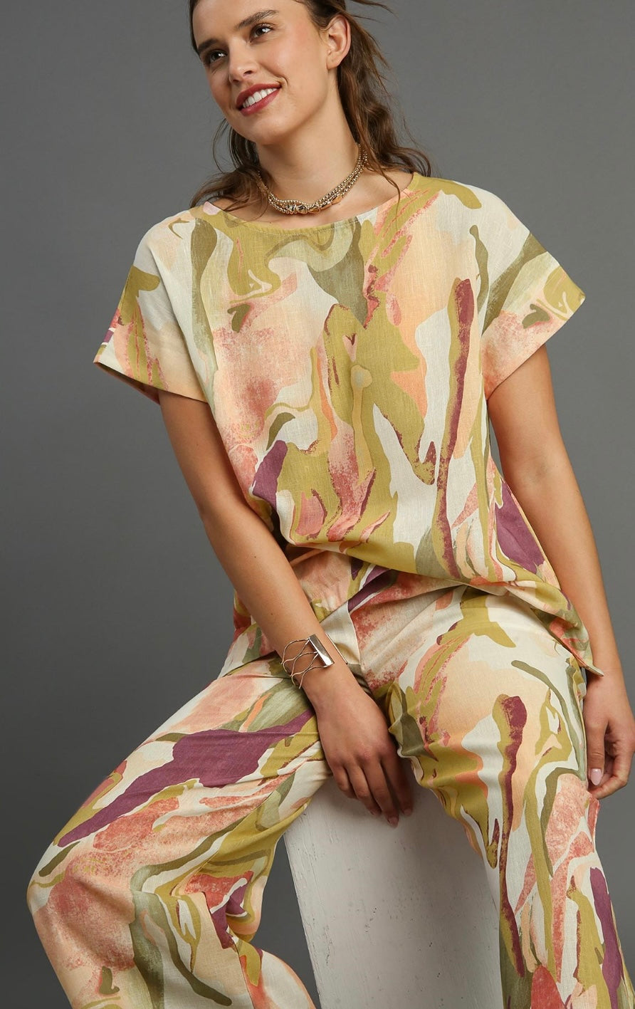ABSTRACT PRINT SHORT SLEEVE PEACH TOP WITH TRIM DETAILS